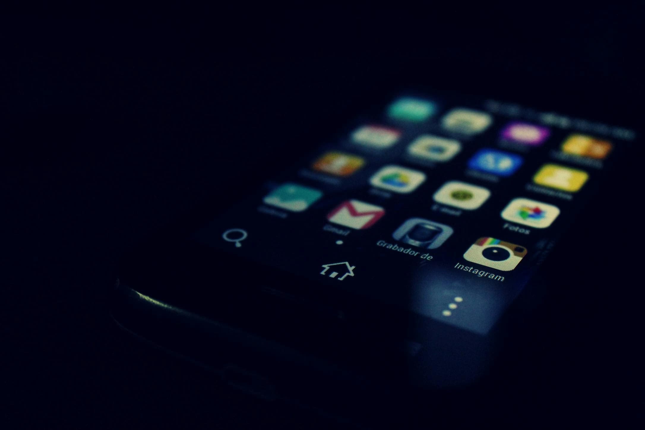 Black android smartphone showing instagram and gmail application