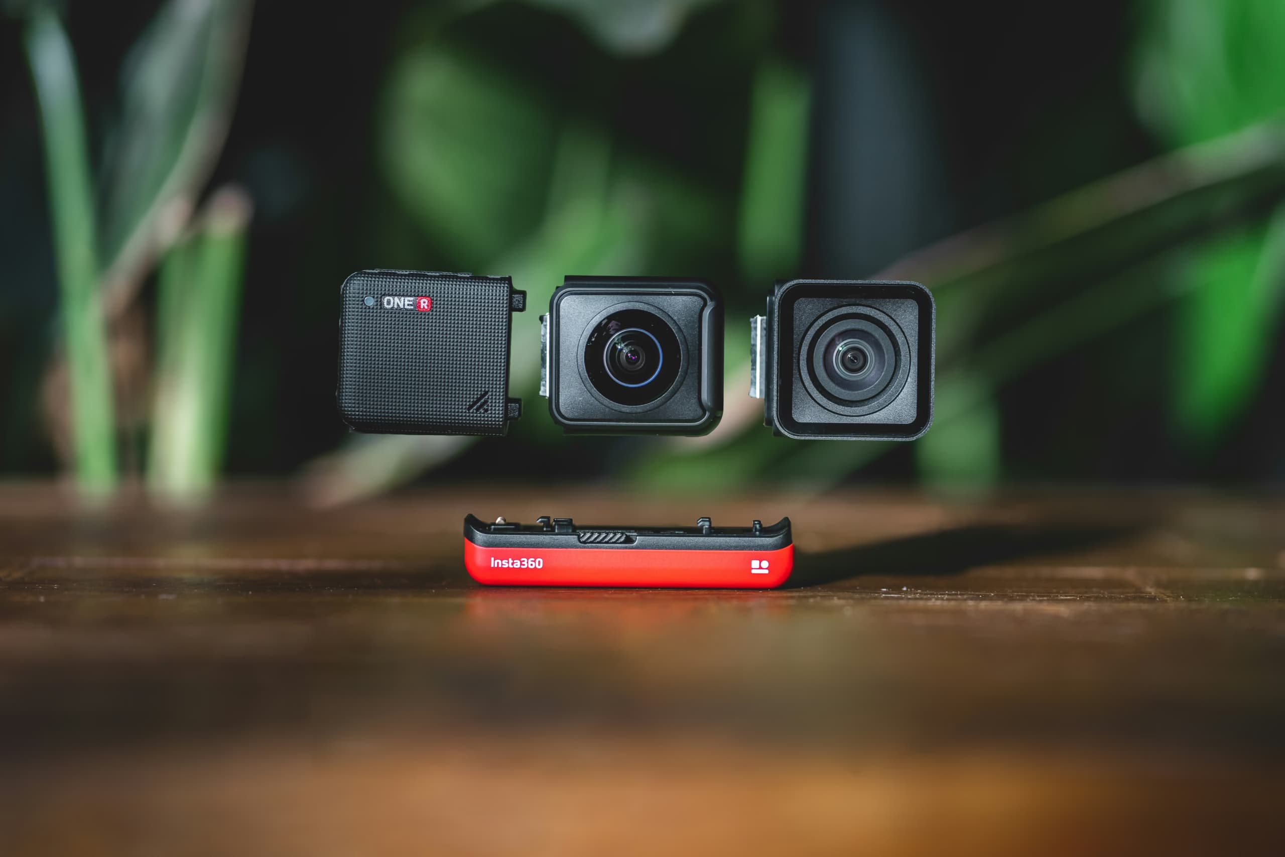 Insta360 One R module action camera. Product photos from 360 action camera on a wooden table.